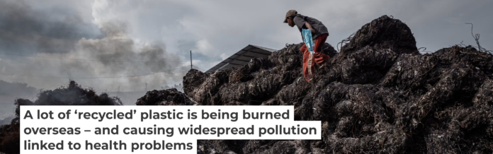 Workers prepare to burn imported plastic waste at a dump in East Java, Indonesia, in 2018. Ulet Ifansasti/Getty Images